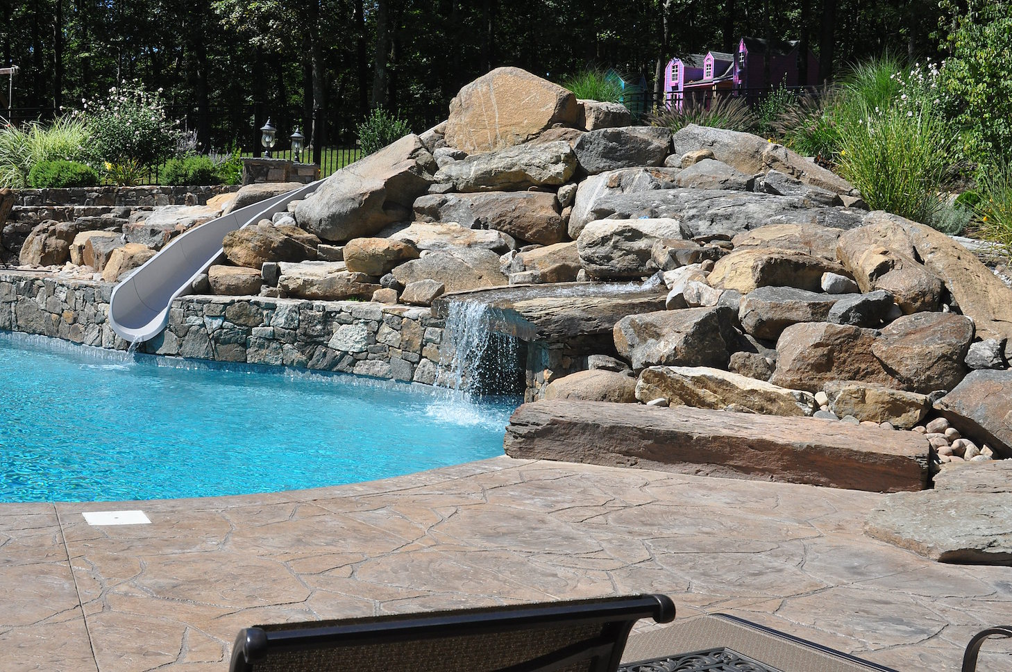 Custom water feature designed to complement a larger outdoor living environment